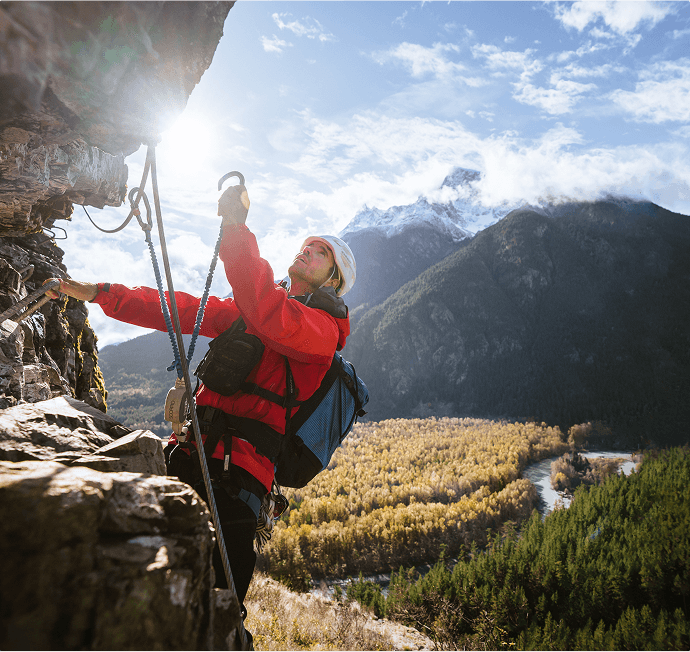 A man climbing a mountain side