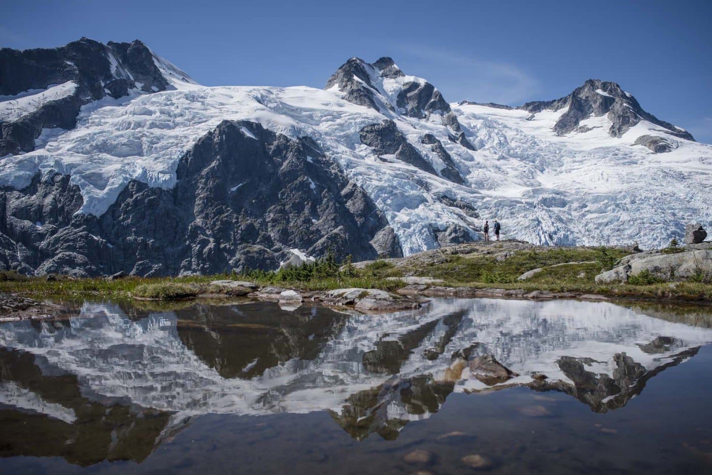 Two people hiking on a mountain