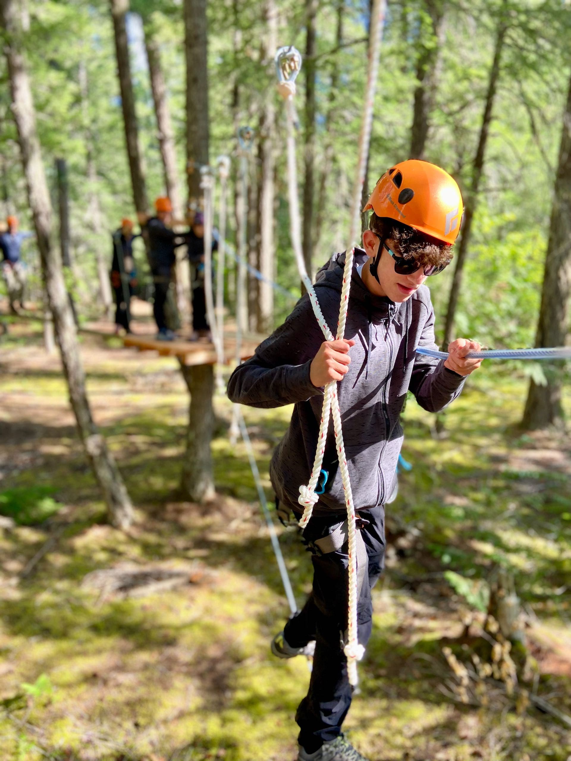 A person on the low ropes course