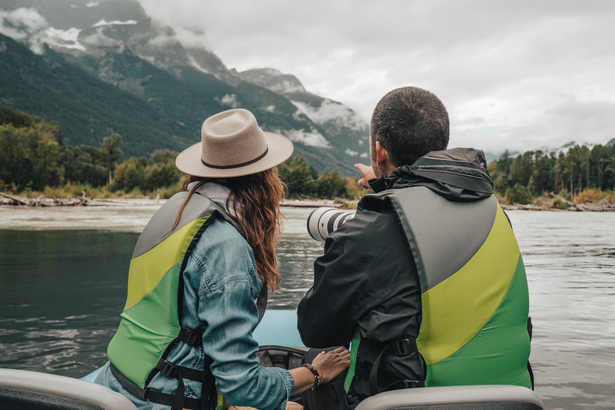 Two people in a boat looking for bears