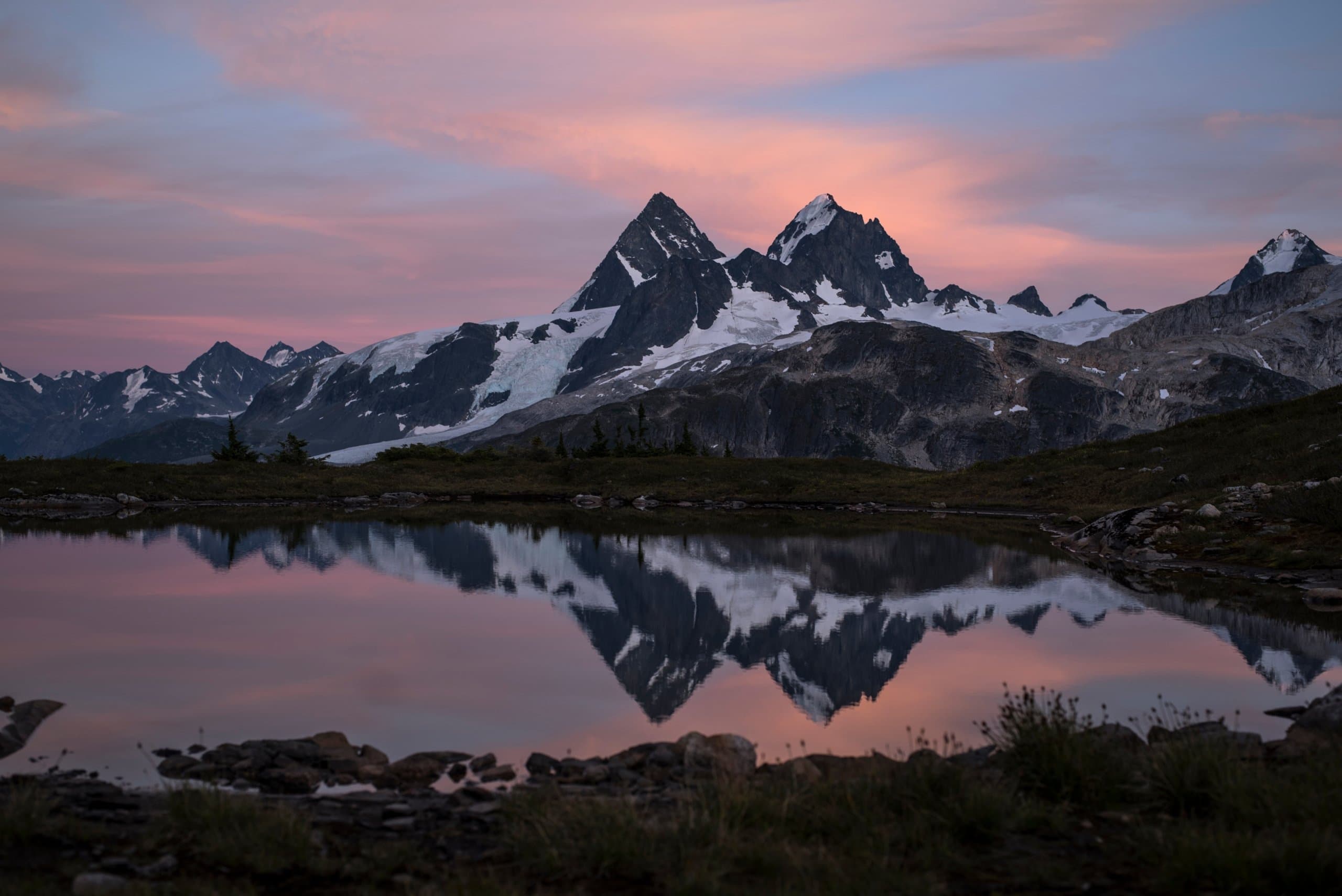 A mountain range reflecting on the water