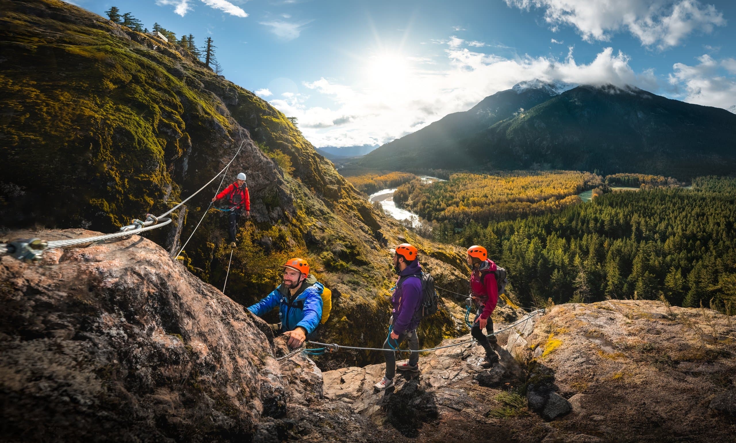 A group of people climbing in the mountains