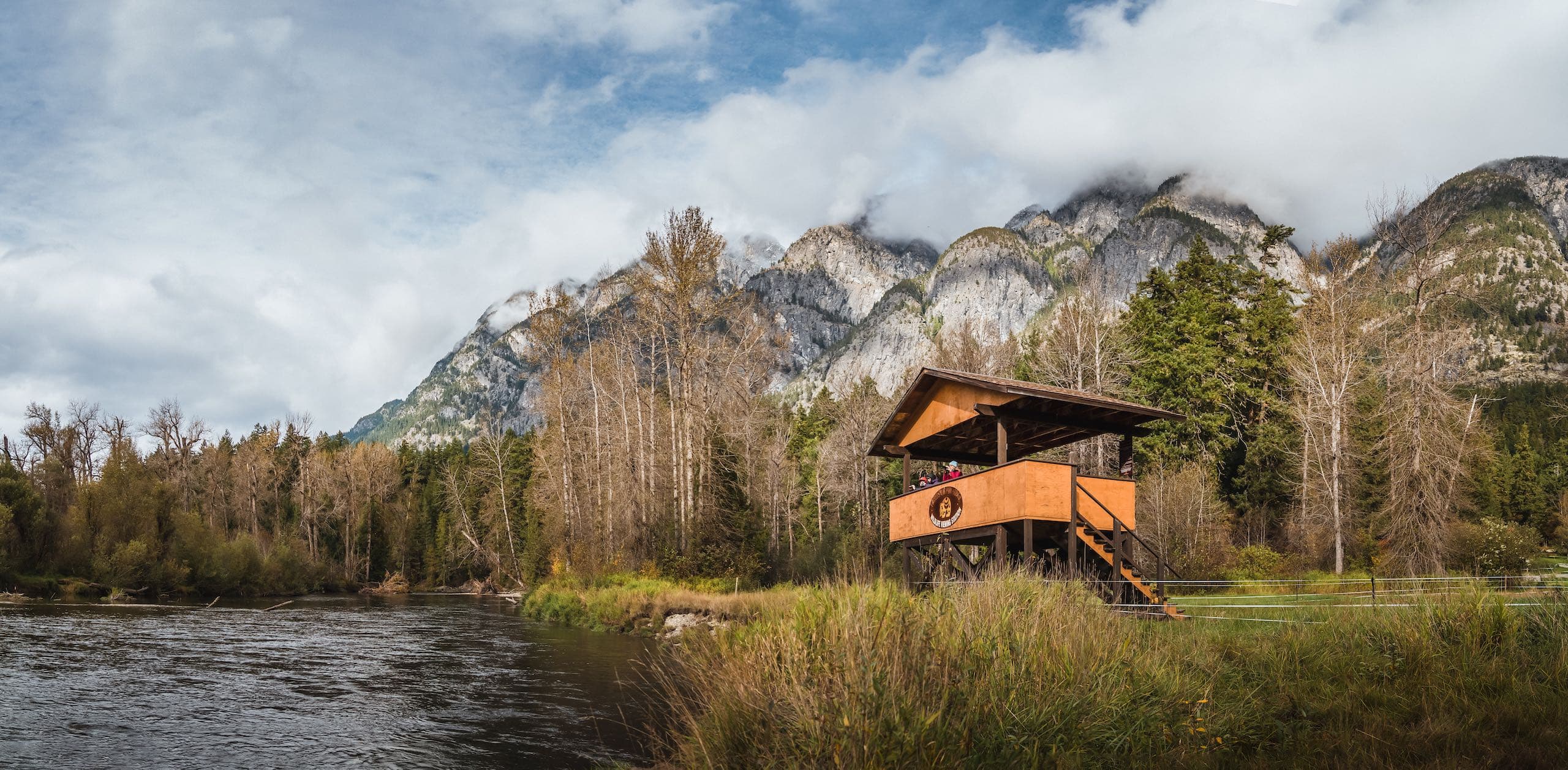 People at a viewing platform overlooking the river