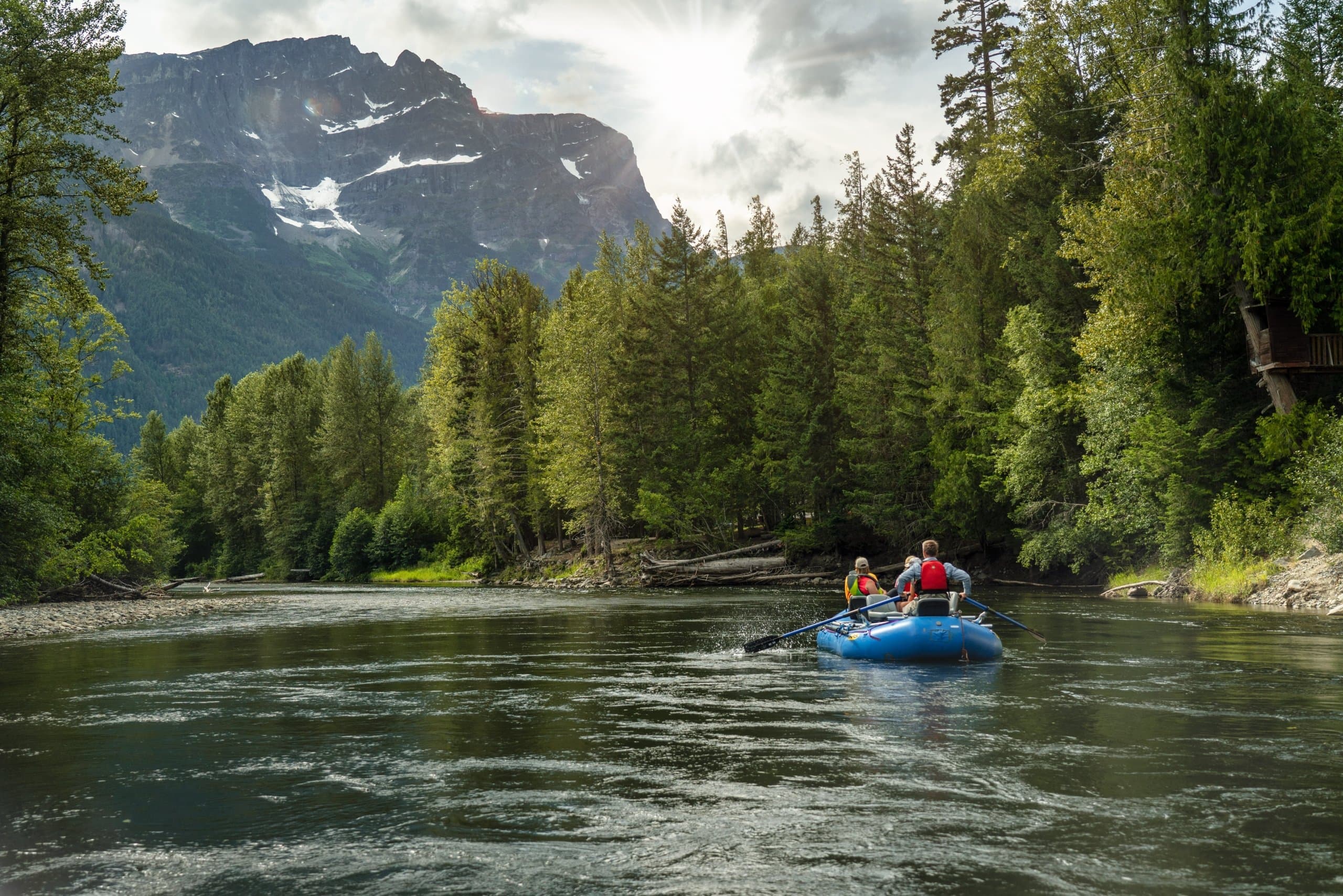 A group of people drifting down the river