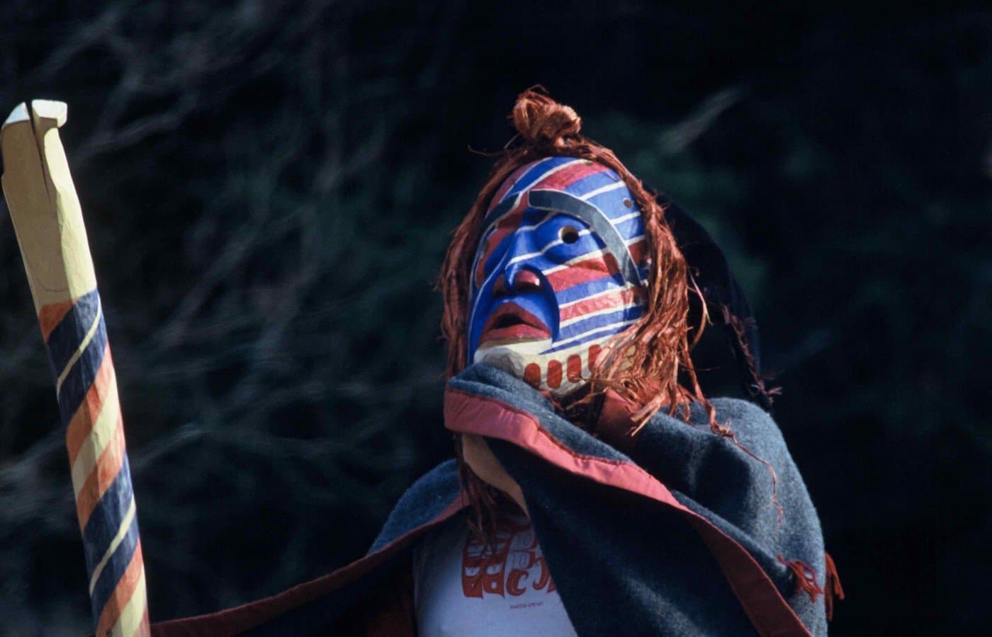 A person in costume leading a boat
