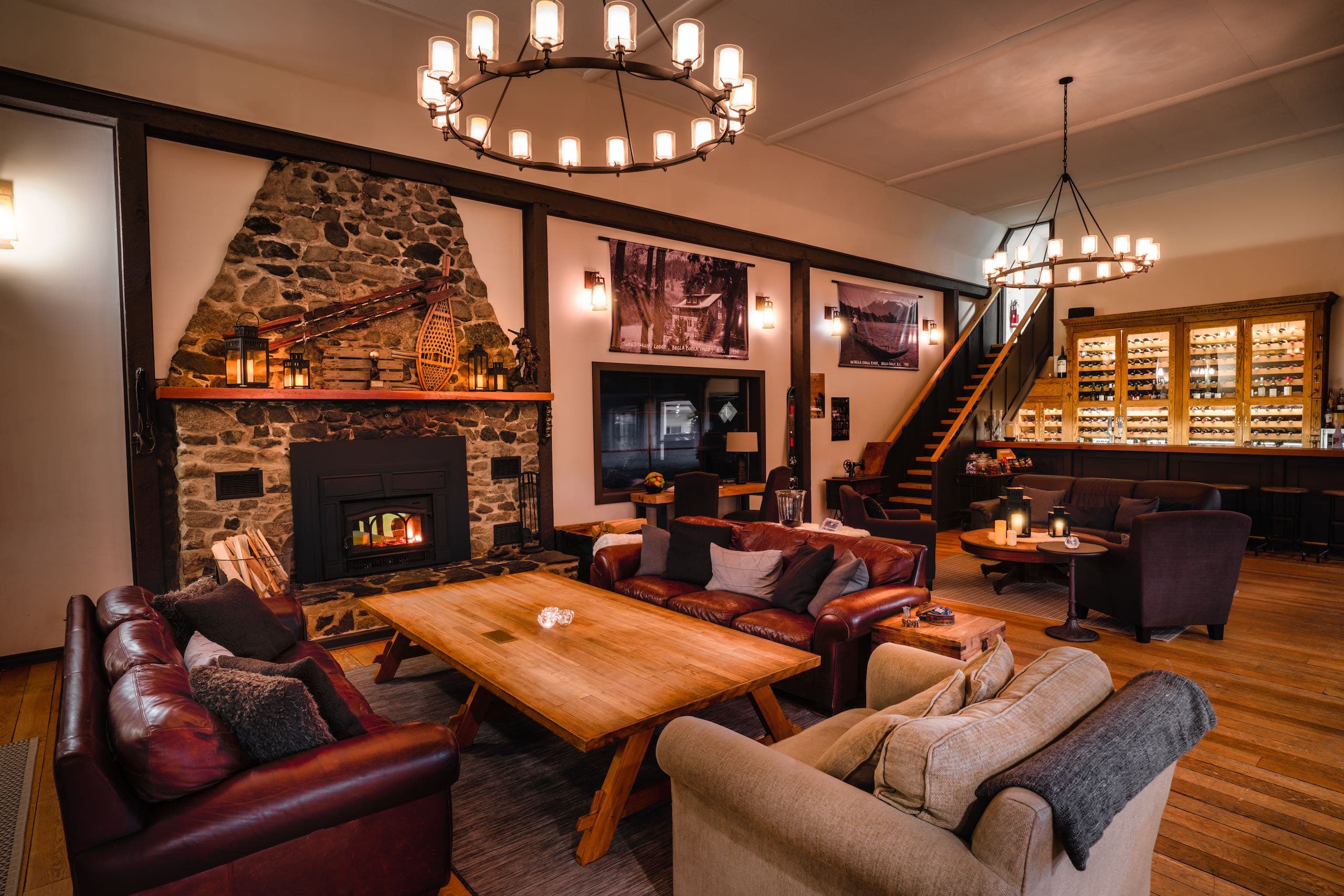Inviting lounge area at the summit lodge of Bella Coola Heli Sport, showcasing plush furniture and scenic outdoor vistas.