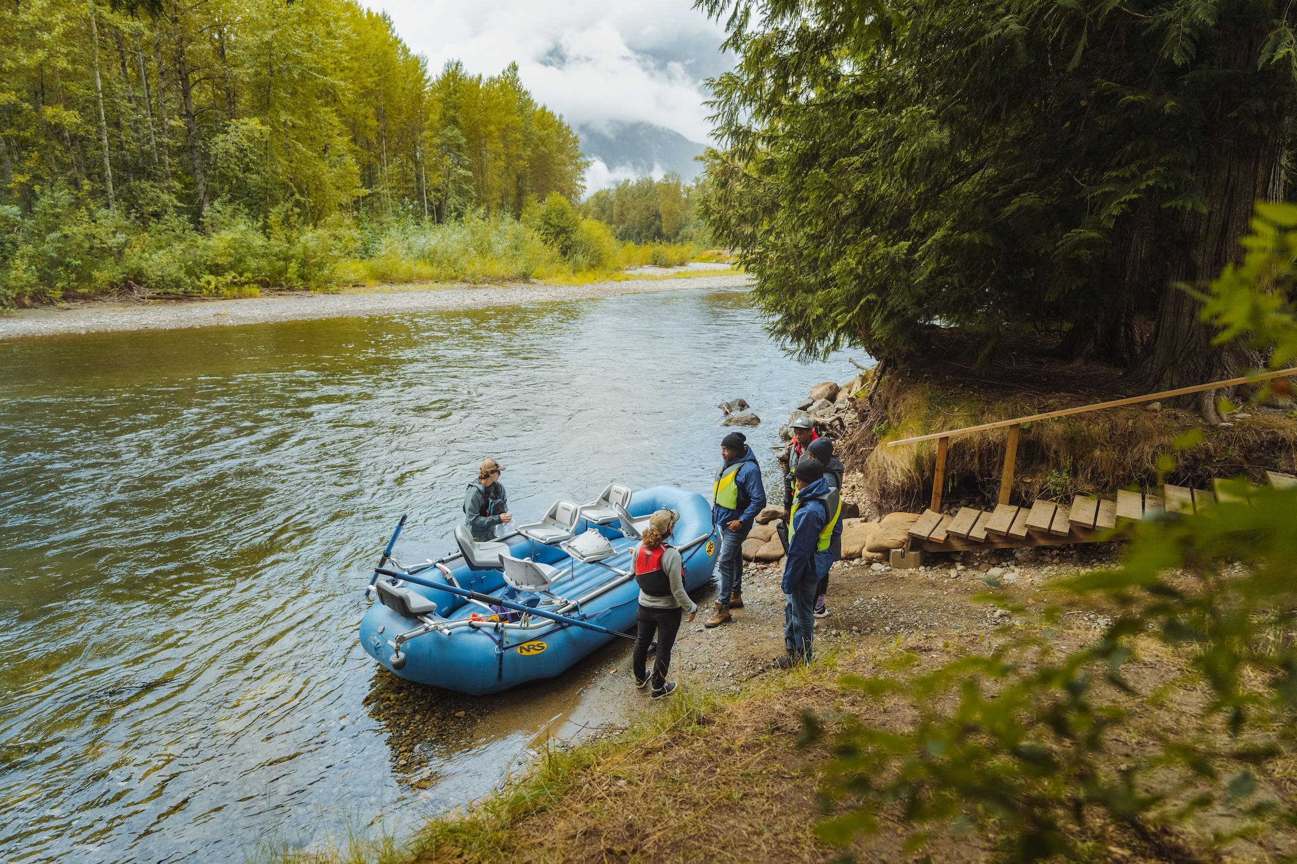 People on the shore about to get into a boat